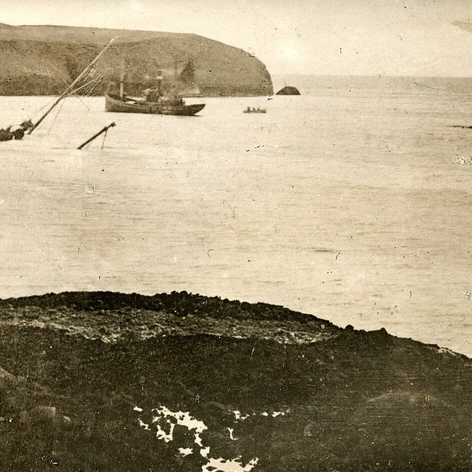 View from land of Stornoway harbour, where Iolaire was wrecked. Her two masts are visible.